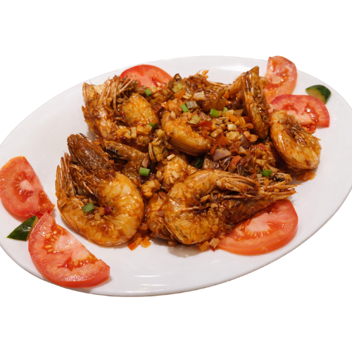 Garlic shrimp sautéed with tomatoes on a plate.