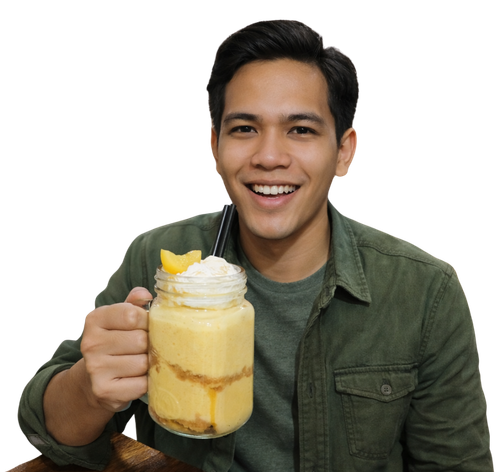Customer holding a mango shake with whipped cream.