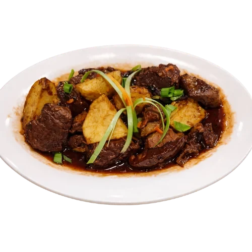 Beef caldereta stew with potatoes in rich sauce.