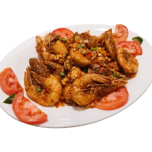 Garlic shrimp sautéed with tomatoes on a plate.